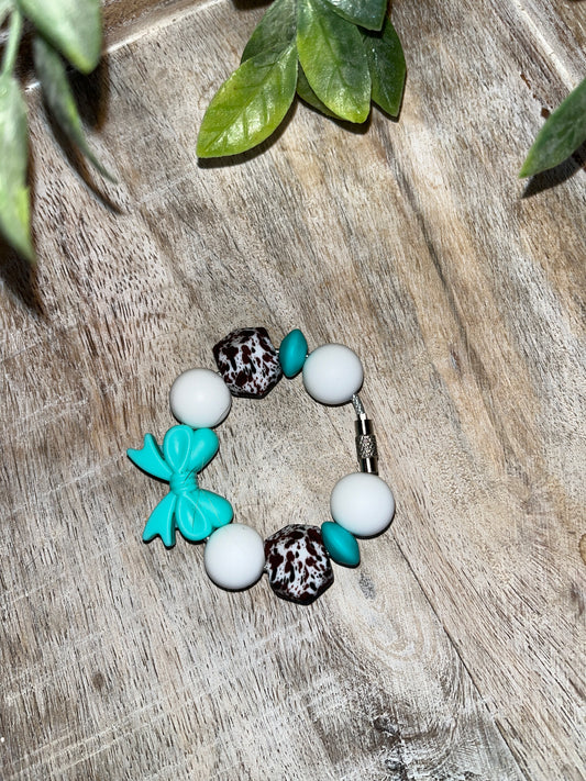Turquoise Bow Cup Charm